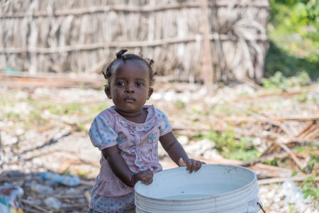 Zanzibar, Tanzania - january 11, 2020: Unknown african young girl on a street of Zanzibar island, Tanzania, East Africa, close upのeditorial素材