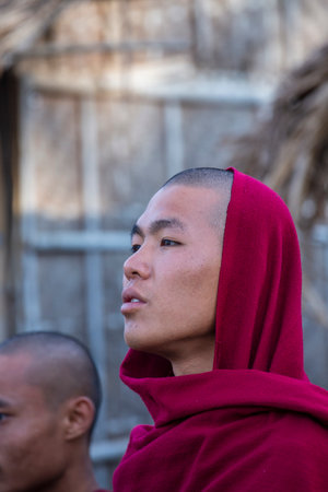 Inle lake, Myanmar, Burma - jan 12, 2016: Young monk in buddhist monastery near Inle lake, Myanmar,...
