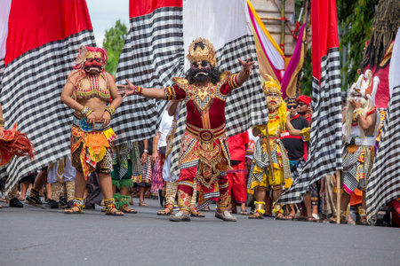 Bali, Indonesia - jan 08, 2018: Balinese man, wearing a Hanuman mask, participates in a street ceremony, during a pre-election rally, the Indonesian Democratic Party of Struggle in Bali, Indonesiaのeditorial素材