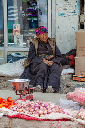 Leh, India - June 21, 2015: Indian old woman on the street market in mountain village Leh, Ladakh region, north India, close upのeditorial素材