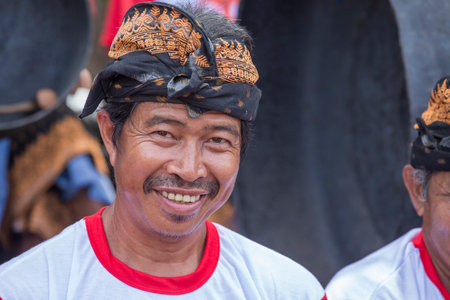 Bali, Indonesia - jan 08, 2018: Balinese old man participates in a street ceremony, during a pre-election rally, the Indonesian Democratic Party of Struggle in island Bali, Indonesiaのeditorial素材