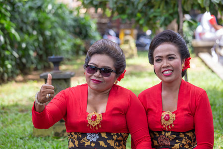 Bali, Indonesia - jan 08, 2018: Balinese woman dressed in national costume, participates in street ceremony pre-election rally the Indonesian Democratic Party of Struggle in island Bali, Indonesiaのeditorial素材