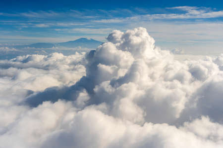 Flying above the clouds. Airplane window viewの写真素材