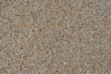 Sandy beach background. Detailed sand texture. Top view, close upの写真素材