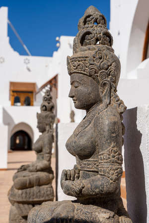 Buddhist statues in front of the hotel entrance for good luck and attraction of tourists to the...