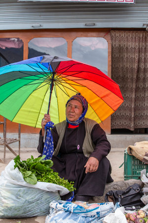 Leh, India - June 24, 2015: Indian old woman on the street market in mountain village Leh, Ladakh region, north India, close upのeditorial素材