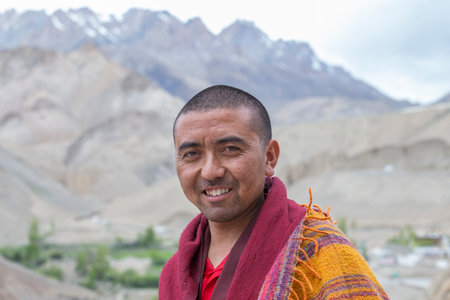 Lamayuru Gompa, Ladakh, India - June 15, 2015: Buddhist monk on the street next to the monastery...