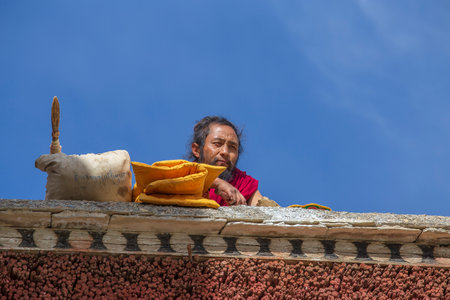 Lamayuru Gompa, Ladakh, India - June 15, 2015: Buddhist monk on the street next to the monastery Lamayuru in Ladakh, North Indiaのeditorial素材