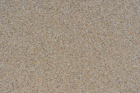 Sandy beach background. Detailed sand texture. Top view, close upの写真素材