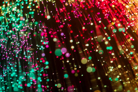 Abstract background of blurred lights with bokeh effect. Vibrant glitter vintage lights background,...
