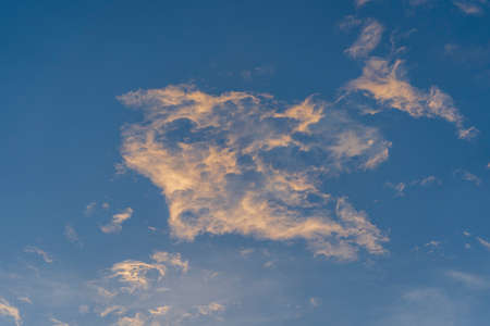 Blue sky background with white clouds during sunset
