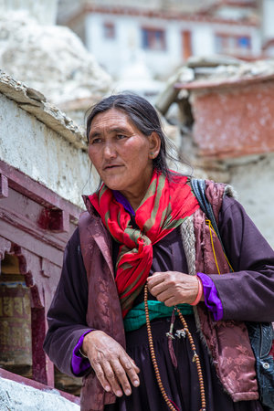 Lamayuru Gompa, Ladakh, India - June 15, 2015: Old Buddhist woman on the street next to the monastery Lamayuru in Ladakh, North Indiaのeditorial素材
