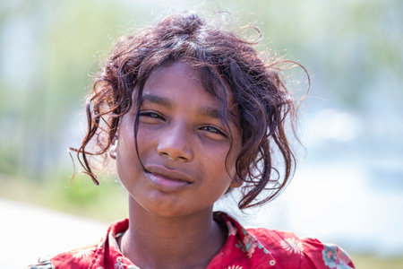 Himalayan mountain village, Nepal - oct 23, 2016: Poor nepalese girl on the street in a Himalayan...