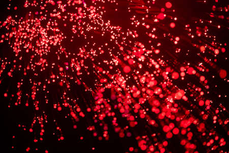 Abstract background of blurred lights with bokeh effect. Red glitter vintage lights background,...