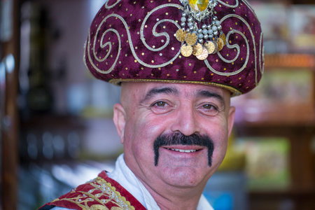 Kemer, Turkey - Oct 18, 2017 : Portrait of a Turkish man dressed in national clothes, which sells...