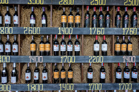 Koh Phangan, Thailand - Feb, 20, 2022 : Bottles of wine on the shelves in the wine store on island Koh Phangan, Thailandのeditorial素材