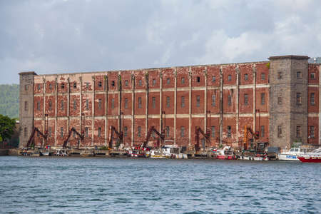 Port Louis, Island Mauritius - March 18, 2017 : Industrial port where imported goods are offloaded from vessels and stored in huge buildings, Mauritiusのeditorial素材