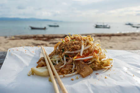 Pad thai or phad thai, is a stir-fried rice noodle dish commonly served as a street food in Thailand. Made with rice noodles, shrimp, peanuts, egg, and bean sprouts, among other vegetablesの写真素材