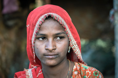 Pushkar, India - Nov 17, 2018: Indian young girl in the desert Thar on time Pushkar Camel Mela near...