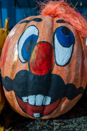 Happy ukrainian man face on painted pumpkin, close up. Ukraineの写真素材