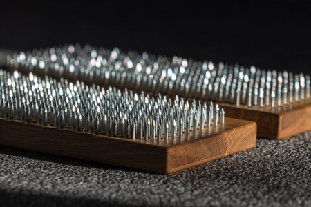 Two wooden board sadhu with nails for practicing yoga, close up. Concept of healthy stimulation of blood flow in the legs, mental health, spiritual developmentの写真素材