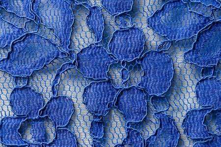 Detail of a blue women blouse made of guipure fabric, close upの写真素材