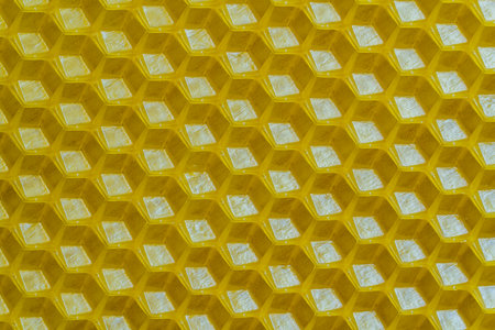 Background texture and pattern of section voshchina of wax honeycomb from a bee hive for filled with...