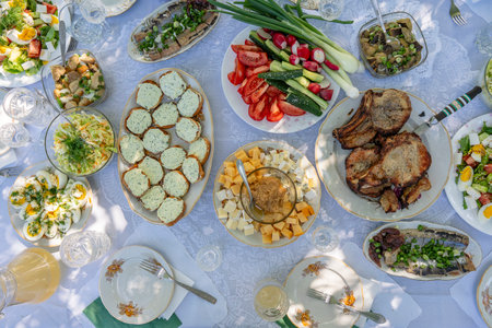 Top of view full table of ukrainian meals on the table for eat. Table with many ready meals and food, outdoors, close upの写真素材