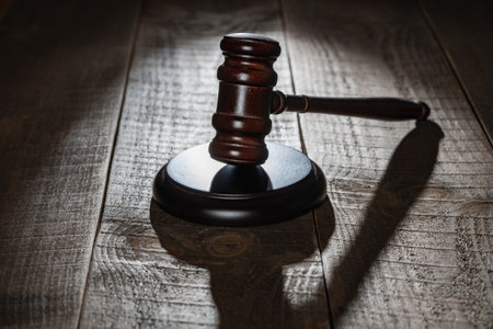 Wooden judge gavel and soundboard on the wooden table background, close upの写真素材