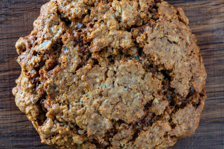 Crust on oat cookies as an abstract background or texture, close up, top view, macro