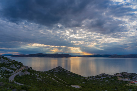 Beautiful view in sunset over Adriatic sea with dramatic sky, Croatia, Central Europe, travel and...