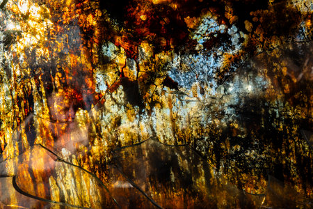 Armor piercing glass of a damaged and burned military infantry fighting vehicle during the war between Russia and Ukraine. Background and texture of armor-piercing glass after an attack and fireの写真素材