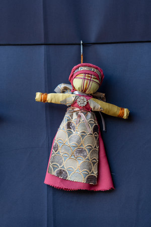 Close-up of a traditional amulet doll for sale to tourists at a street market in Kyiv, Ukraine. Ukrainian motanka dollsの写真素材