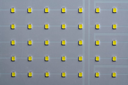 White LED panel with yellow light on background, top view, close up