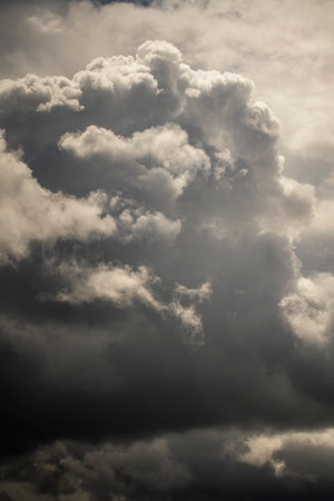Sunset beautiful clouds on the dramatic stormy sky background before the rain. Dark stormy sky...