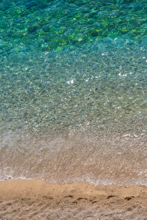 Crystal clear turquoise sea water on a pebble beach, Croatia. Dalmatian Coast of Adriatic Sea,...