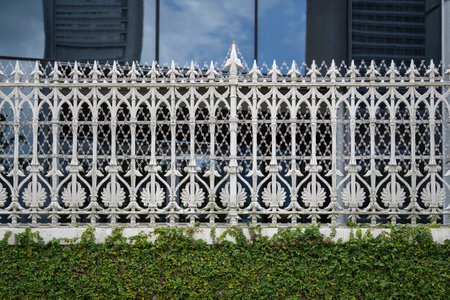 White cast-iron fence with patterns, fragment close up, outdoorsの写真素材