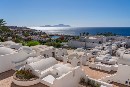 White wall buildings near Red sea on the tropical beach on sunny day in resort town Sharm El Sheikh, Egypt, architecture conceptの写真素材