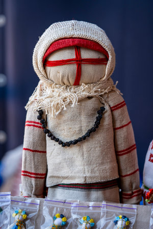 Close-up of a traditional amulet doll for sale to tourists at a street market in Kyiv, Ukraine. Ukrainian motanka dollsの写真素材
