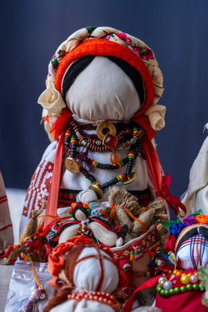 Close-up of a traditional amulet doll for sale to tourists at a street market in Kyiv, Ukraine. Ukrainian motanka dollsの写真素材