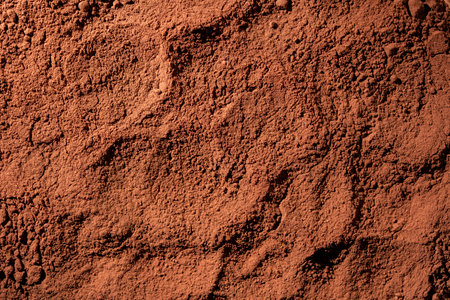 Natural dark brown cocoa powder textured background, close up, top viewの写真素材