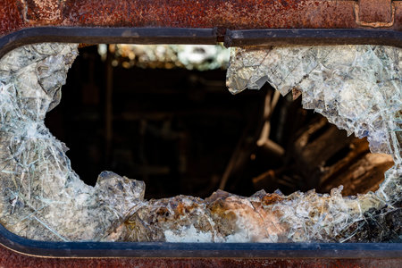 Bullet hole in armor-piercing glass. Armor piercing glass of damaged military infantry fighting...