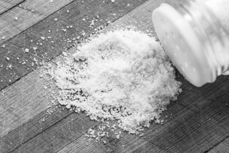 Salt crystals on a wooden boardの写真素材