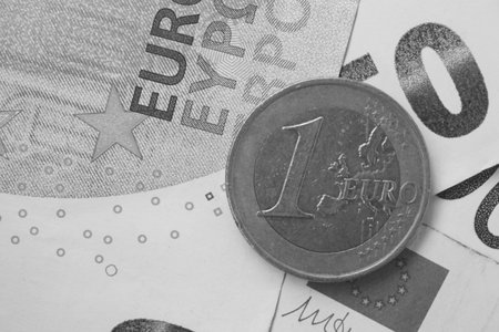 Thundering European Union (Euro) banknotes on a sunny day