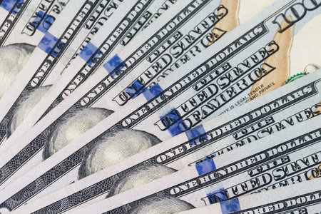 Thundering US dollar bills on a sunny day
