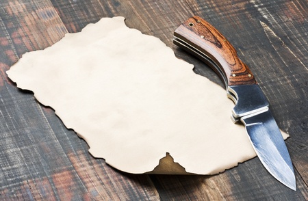 old paper and pocket knife with wooden handle