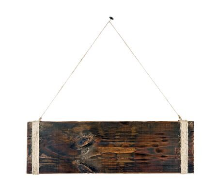 A blank piece of wood hanging from a nailの写真素材