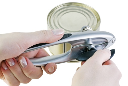 hand opens a jar of canned food isolated on whiteの写真素材