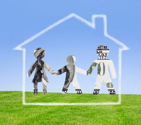 Family cut out from a dollar denomination and the house from clouds の写真素材