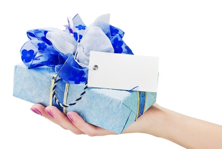 gift with a business card in his handの写真素材